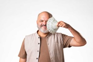 Man holding lots of money