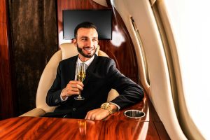 Man having wine on airplane, pride